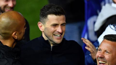 Portsmouth manager John Mousinho celebrates winning League One