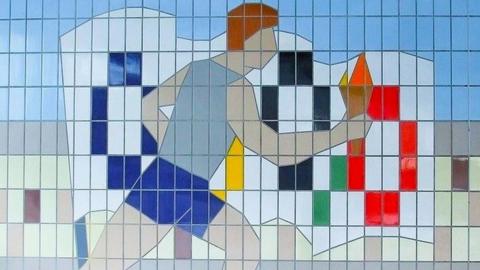 Tile mural of athlete carrying Olympic torch