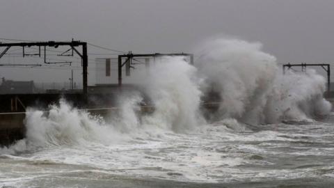 Waves alongside railway tracks