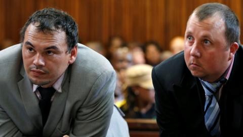 Farmers Willem Oosthuizen and Theo Martins (R) in court on 23 October 2017