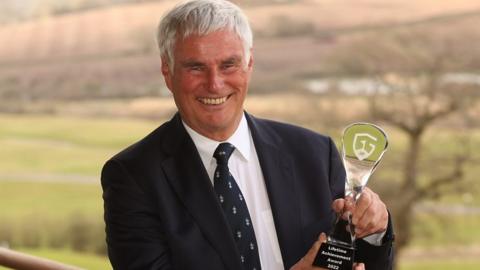 Clive Brown with his Wales Golf lifetime achievement award