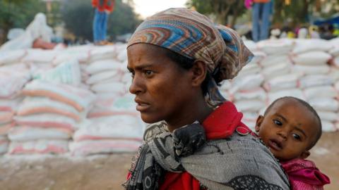 Woman queues for food at a temporary shelter in Tigray (file pic - March 2021)