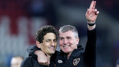 Republic of Ireland manager Stephen Kenny celebrates with his assistant Keith Andrews after the team's 3-0 win in Luxembourg