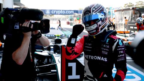 Andrea Kimi Antonelli clenches his fist in celebration after taking pole position for the Miami Grand Prix sprint race
