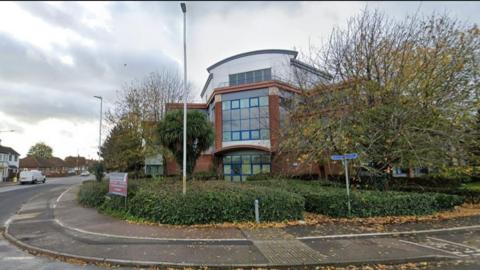 The former Canterbury Christ Church University building on a street corner in Broadstairs with trees around it's modern exterior