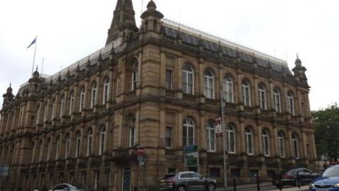 A stone fronted three-storey building in Halifax