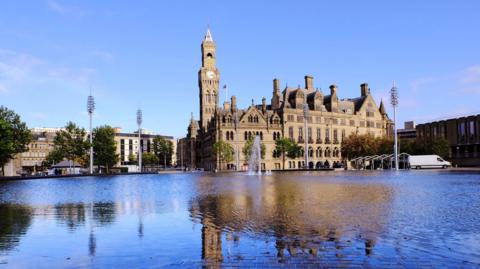 The ornate Grade 1 listed Braford town hall building, completed in 1873 with 'the mirror pool' in foreground