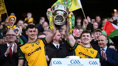 Michael Langan and Shane O'Donnell lift the cup