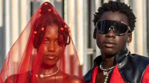 Guests pose for a photograph as they arrive at the Federal Palace Hotel for the Lagos Fashion Week in Nigeria.