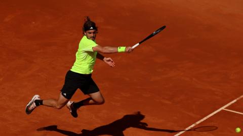 Greece's Stefanos Tsitsipas in action during his match against Italy's Lorenzo Musetti during day eight of the Mutua Madrid Open at La Caja Magica in Madrid, Spain