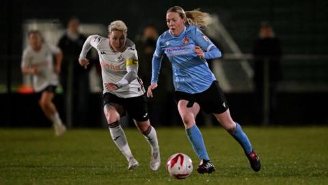 Tija Richardson of Briton Ferry Llansawel is chased by Stacey John-Davis of Swansea City