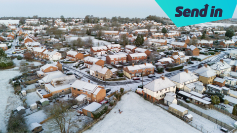 snow covered houses and roads in Warwickshire.