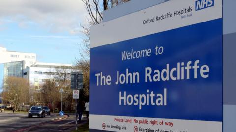 A big sign saying 'Welcome to The John Radcliffe Hospital'
