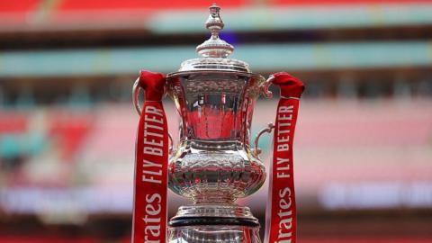 FA Cup trophy on a podium