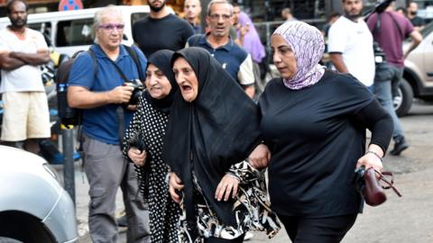 Friends and relatives of injured people arrive at the American University of Beirut Medical Center (AUBMC) in Beirut, Lebanon (17 September 2024)