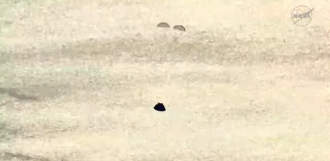 Two parachutes coming from a crew capsule