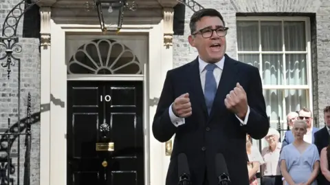 Burnham and wife Frankie outside No 10