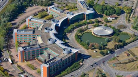 Aerial shot of Reading International Business Park showing building blocks arranged in a semi-circle