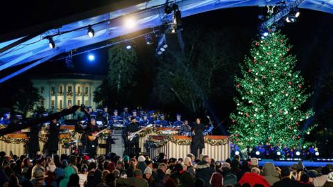 A Christmas Tree is light up in front of the White House.