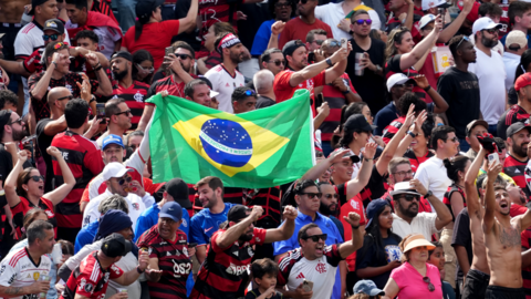 Flamengo fans display a Brazil flag during their sides game with Chelsea at the Fifa Club World Cup