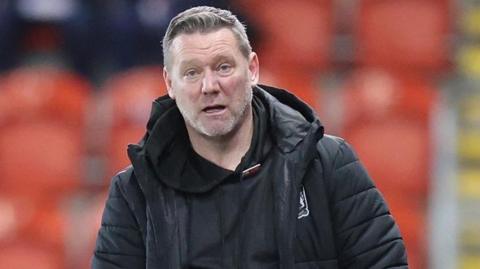 An exasperated-looking Kevin Nolan on the sidelines