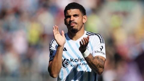 Morgan Gibbs-White of Nottingham Forest acknowledges the fans