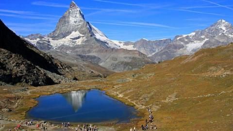 The Matterhorn and Lake Riffelsee near Zermatt, in the canton of Valais in Switzerland