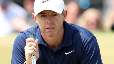 Rory McIlroy lining up a putt