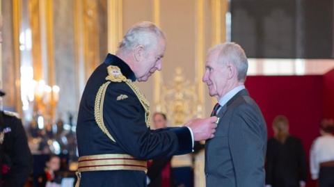 Steve Watts was appointed an MBE by King Charles on Tuesday