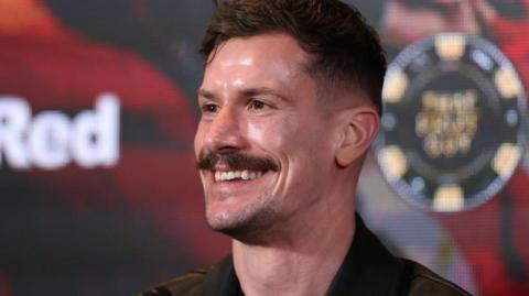 Stoke boxer Nathan Heaney smiles during a press conference