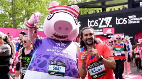 Joe Wicks and Daddy Pig after finishing the 2026 TCS London Marathon