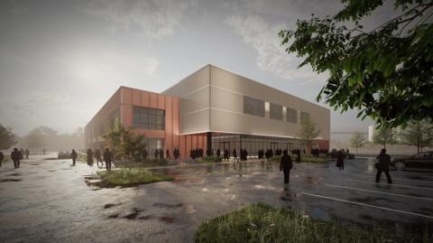 A compute generated image of the proposed TraffordCity Arena development. It is an asymmetric building with red and cream panels 