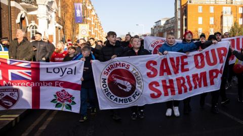 Morecambe fans protest against the club's owners