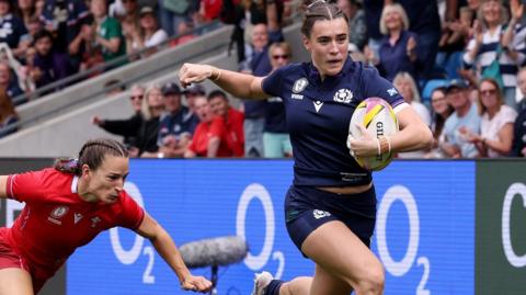 Fran McGhie runs in a try for Scotland