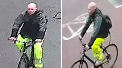 CCTV footage shows a man wearing a black jacket and high-visibility trousers riding a bike on a road. He has a bald head.