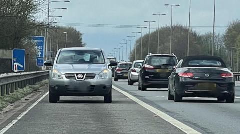 A car facing the wrong way of the M40 at Handcross, High Wycombe