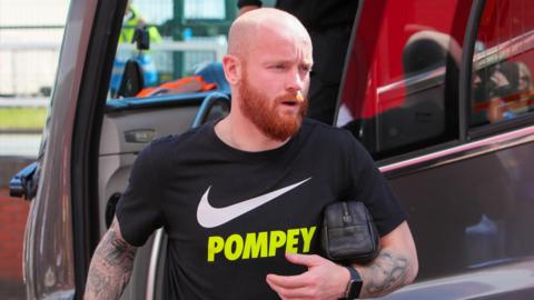 Connor Ogilvie leaves the Portsmouth team bus