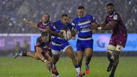 Ollie Lawrence runs with the ball during the match