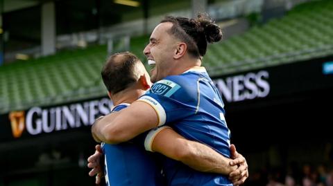 James Lowe celebrates scoring a try against Ulster