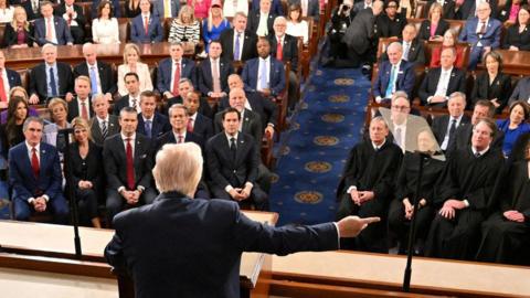 US President Donald Trump gestures as he speaks during an address to a joint session of Congress at the US Capitol in Washington, DC, on March 4, 2025.