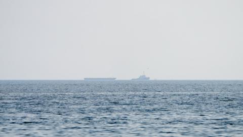 Vessels float in the Strait of Hormuz.