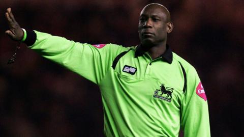 Uriah Rennie refereeing in the Premier League