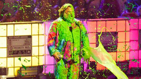 Jack Black gets slimed with green slime as he accepts his award