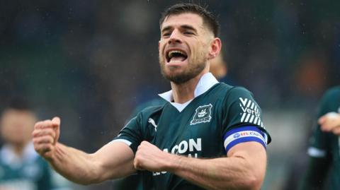 Joe Edwards punches the air in celebration