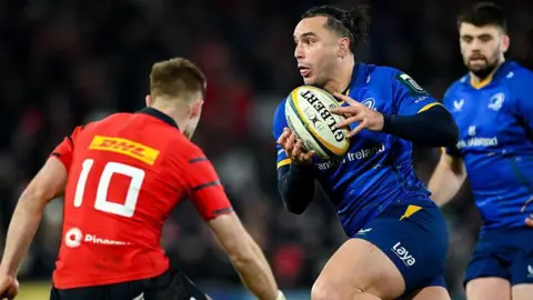 James Lowe with the ball