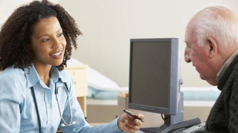 A doctor talks to a patient