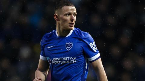 Portsmouth striker Colby Bishop in action wearing his Blue and White Pompey shirt 