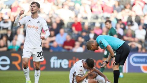 Striker Liam Cullen (L) looks frustrated during Swansea City's defeat by Millwall