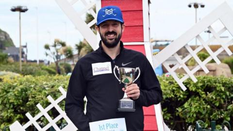 Marc Chapman with the trophy