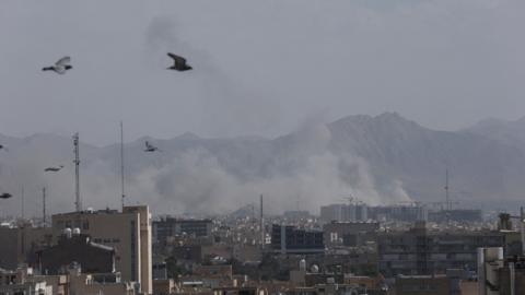 Aftermath of what appears to have been a strike in Tehran, with smoke going up in the air from buildings